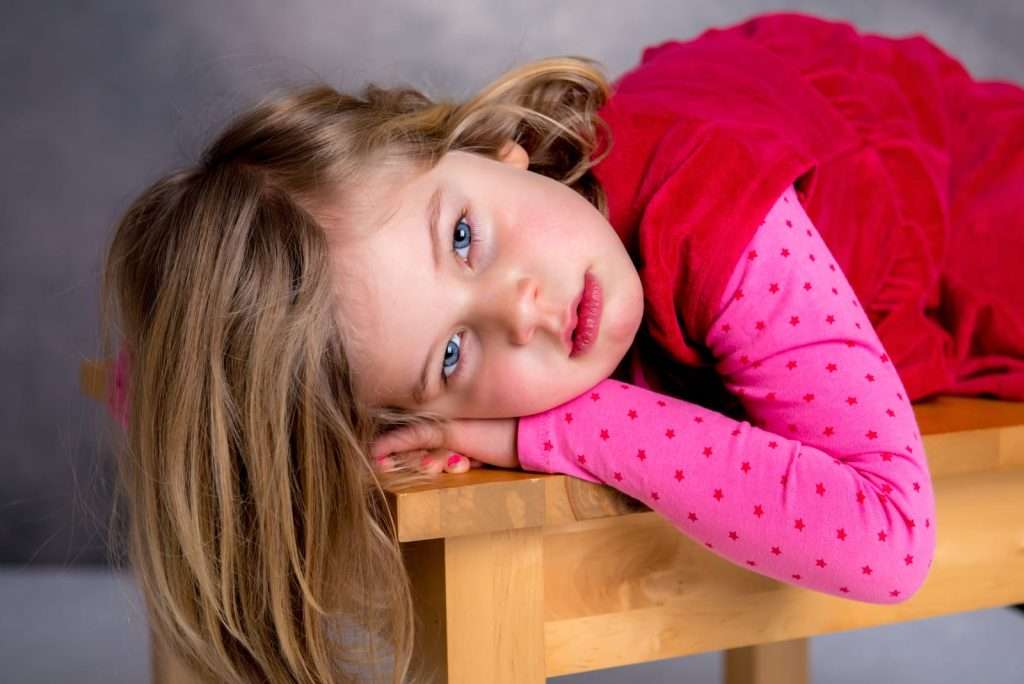 sad little girl, moody 73338188 YI Young child showing behavioral changes and mood symptoms associated with PANS and PANDAS neuropsychiatric disorders.