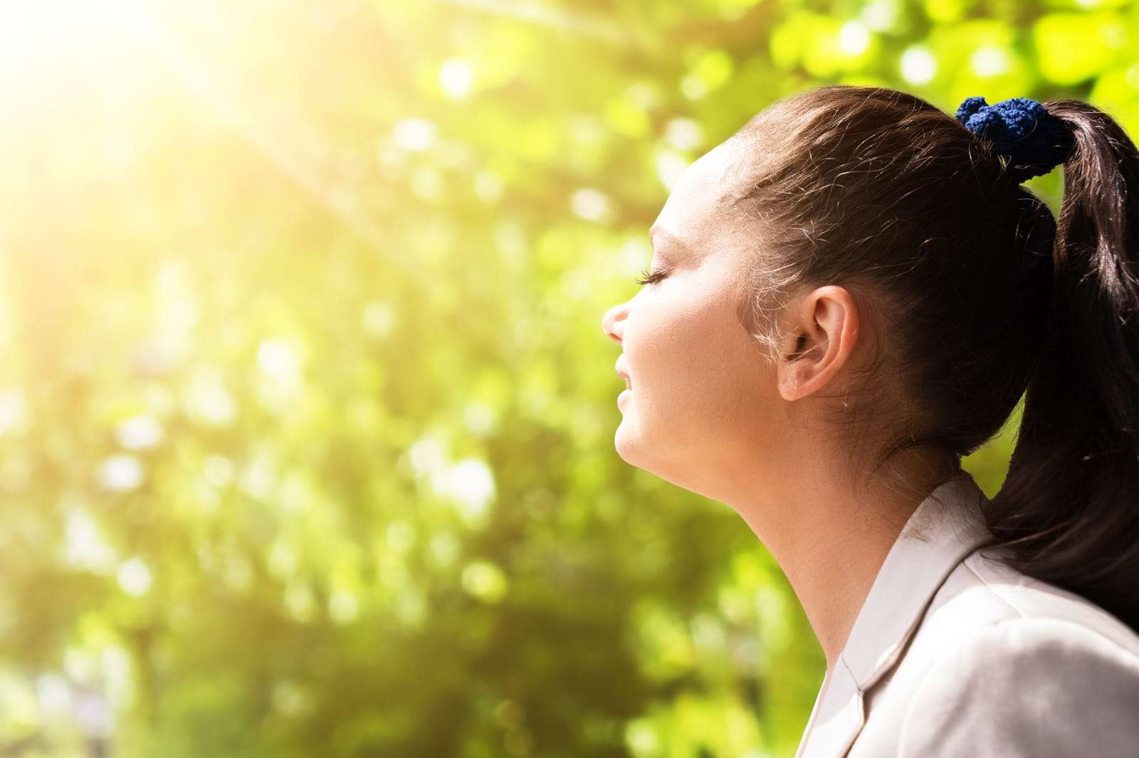 woman getting fresh air in sunshine 81793792 YI Patient receiving Ozone UVBI Therapy to support immune function, detoxification, oxygen utilization, and overall wellness